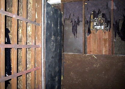 View of the room angled left to the prisoner