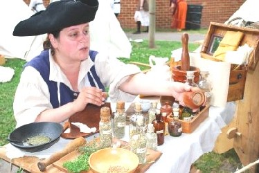 Susan, the apothecary at her table