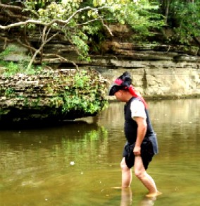 Brandon wading in the water