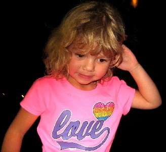 Unsure little girl in a pink shirt