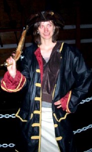 Girl in pirate togs with piistol