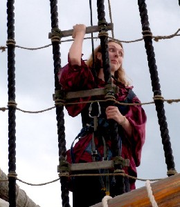 Rosabella looking alarmed while climbing the ropes