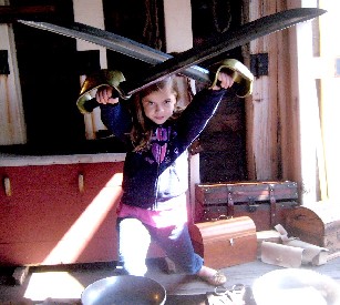 Dramatic girl holding crossed swords