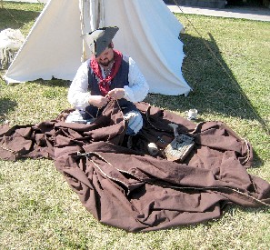 Jack sewing up the brown tent fly