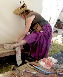 Girl bandaging her leg
