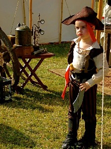 A kid in a Jack Sparrow-ish outift