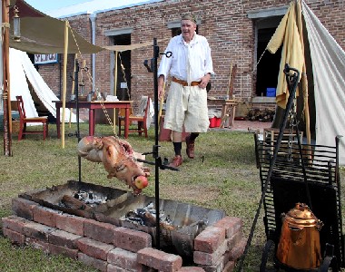 Steve Cooking the Pig in Camp