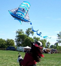 A pirate with hook flies a kite