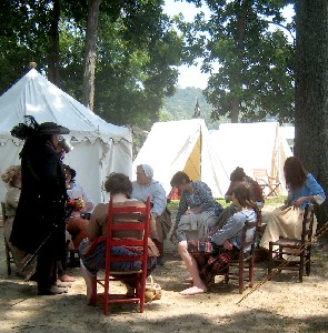 People sitting around their site at Paynetown 2009
