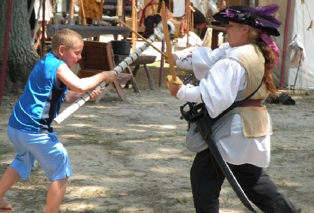 Sharilee hooper swordfighting with kid