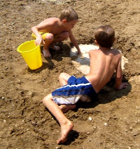 Zach and boy playing in sand