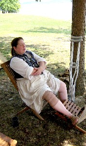 Jennie Gist relaxing under a tree