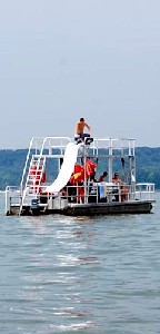 A pontoon boat with a slide
