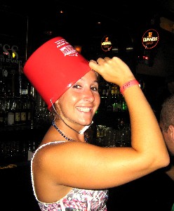 A girl with a red bucket on her head