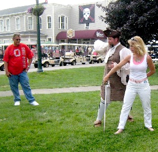 M.A. d'Dogge showing the woman a sword fighting stance