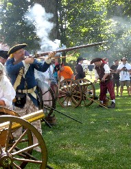 Defenders firing their muskets.