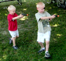 Kids Firing Toy Guns