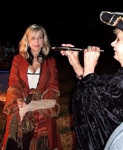 Brig presents an item to an audience member