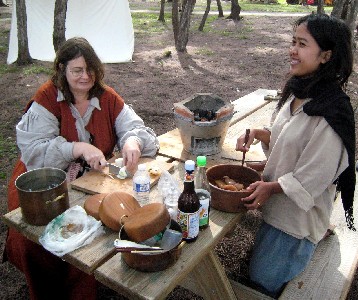 Anne-Coates Sharp and Sansanee preparing food