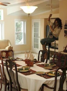Eduordo overlooks the dining room table