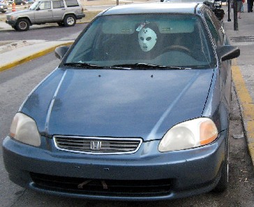 Hockey mask on a car rear-view mirror